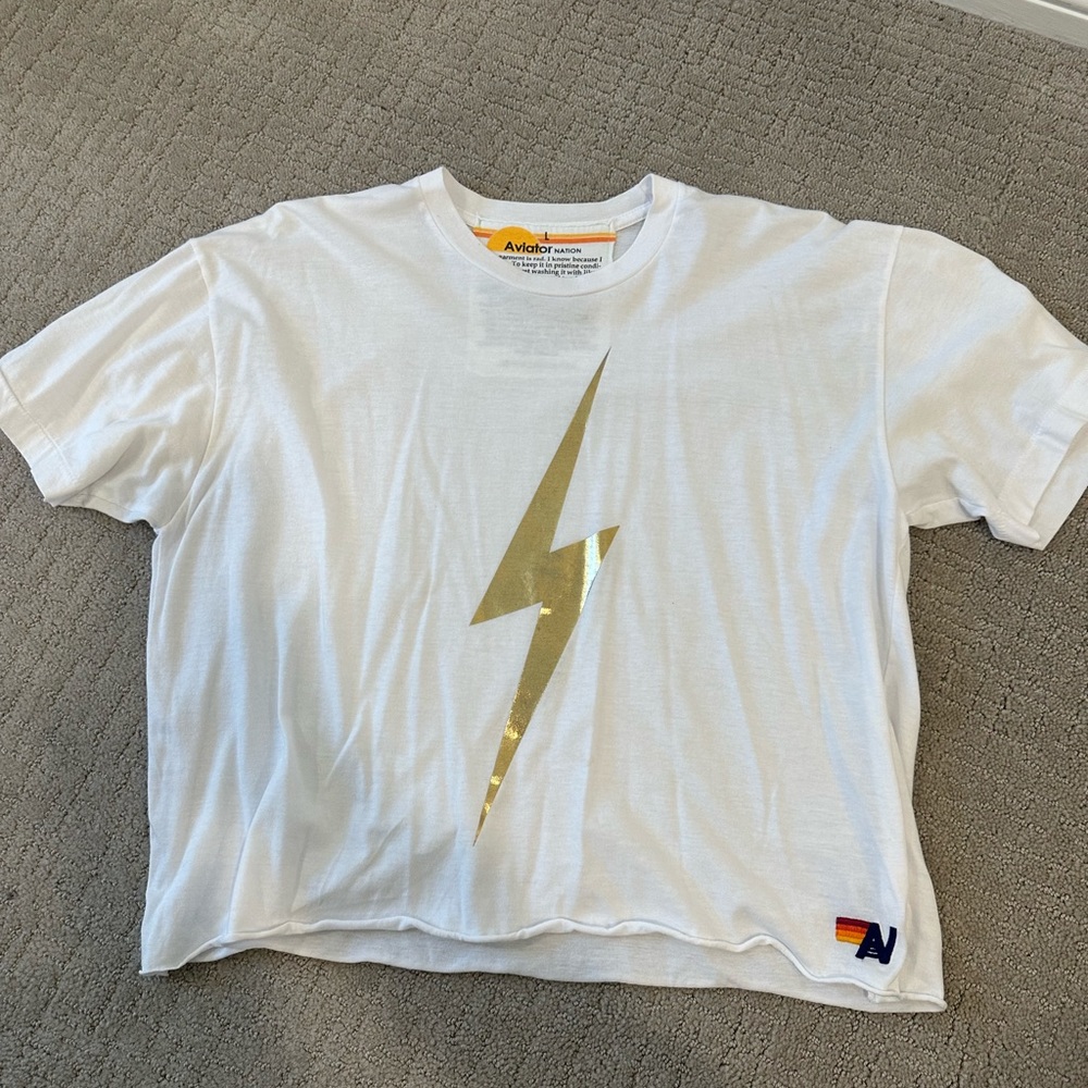 Aviator Nation white and gold lightning bolt t-shirt.